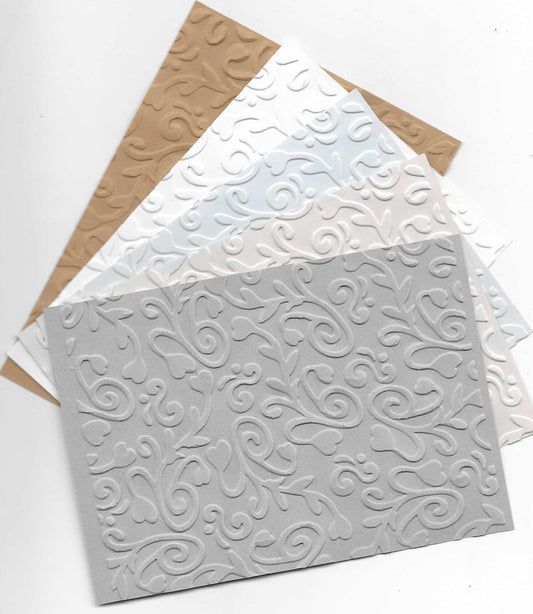 10 Sheets of A6 Embossed Card. Flourishes Design in Assorted Colours.